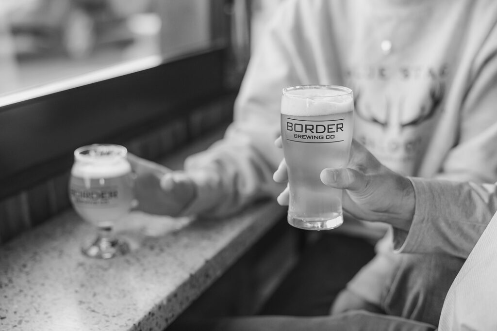 Two glasses of Border Brewing Company beverages side by side