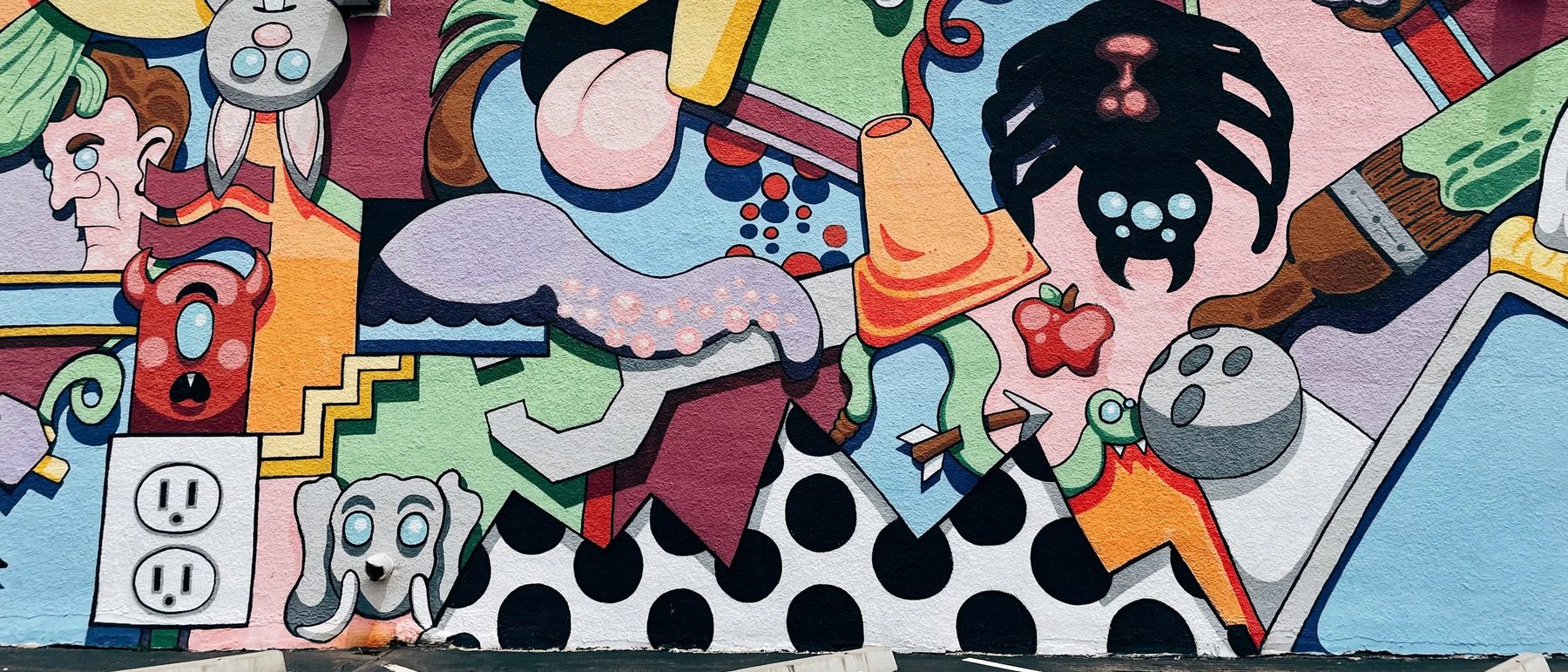 Cartoon street art mural in the Crossroads Arts District