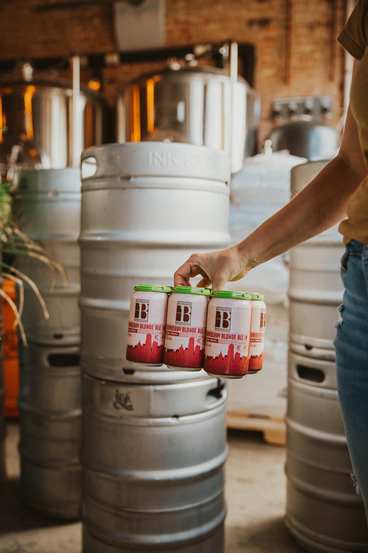 A 6 pack of Border Brewing Company's Strawberry Blonde Ale inside our Crossroads Taproom in Kansas City, MO