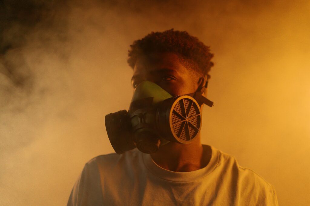 Young man in a gas mask to represent toxicity