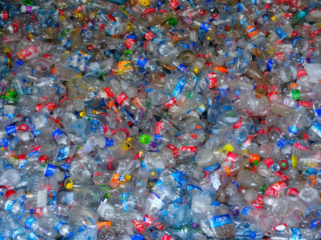 Lots of trash bottles that should be recycled that create plastic pollutions and microplastics